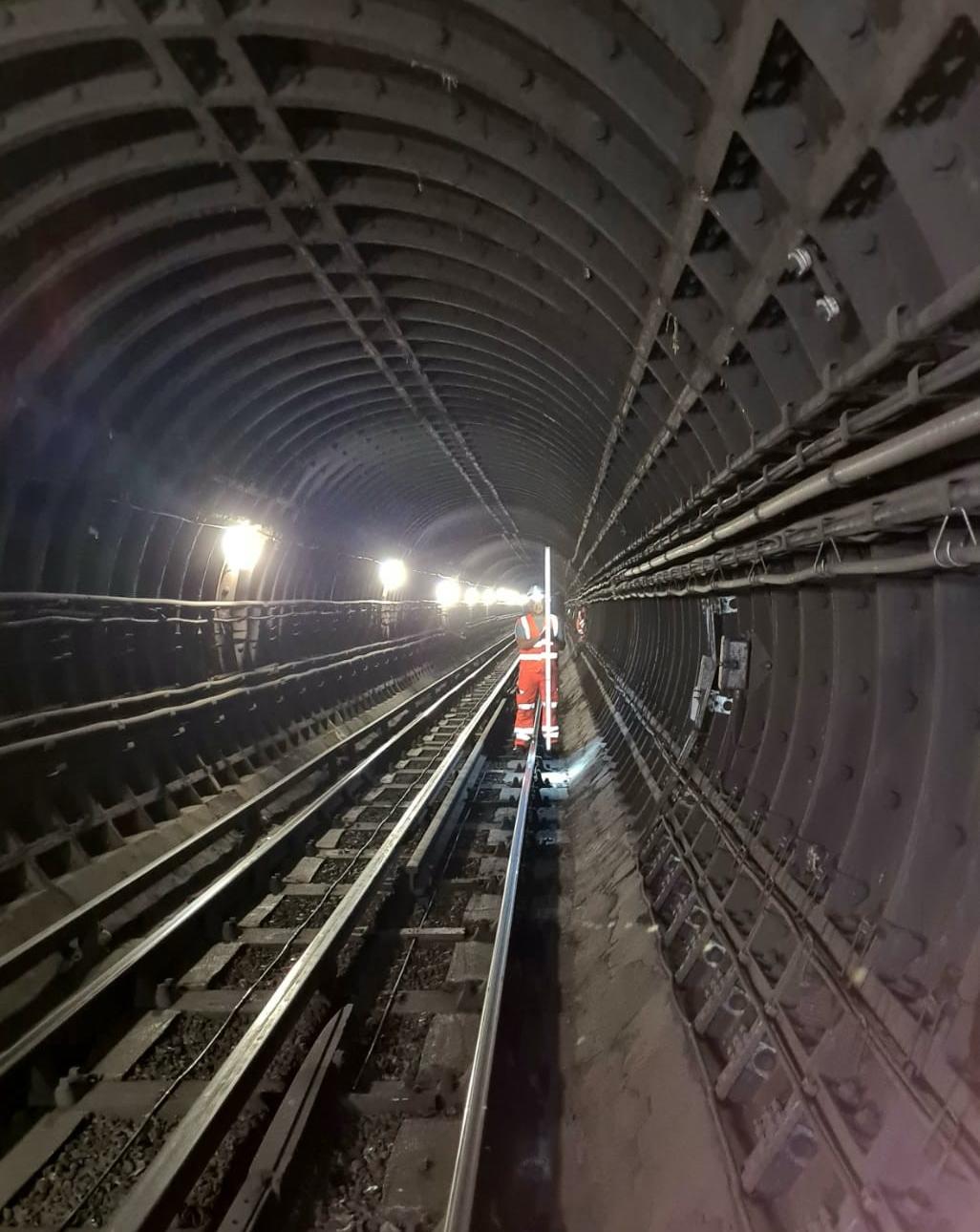 Levelling survey in a London Underground tunnel.