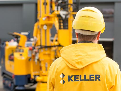 man in yellow jacket with keller logo on the back